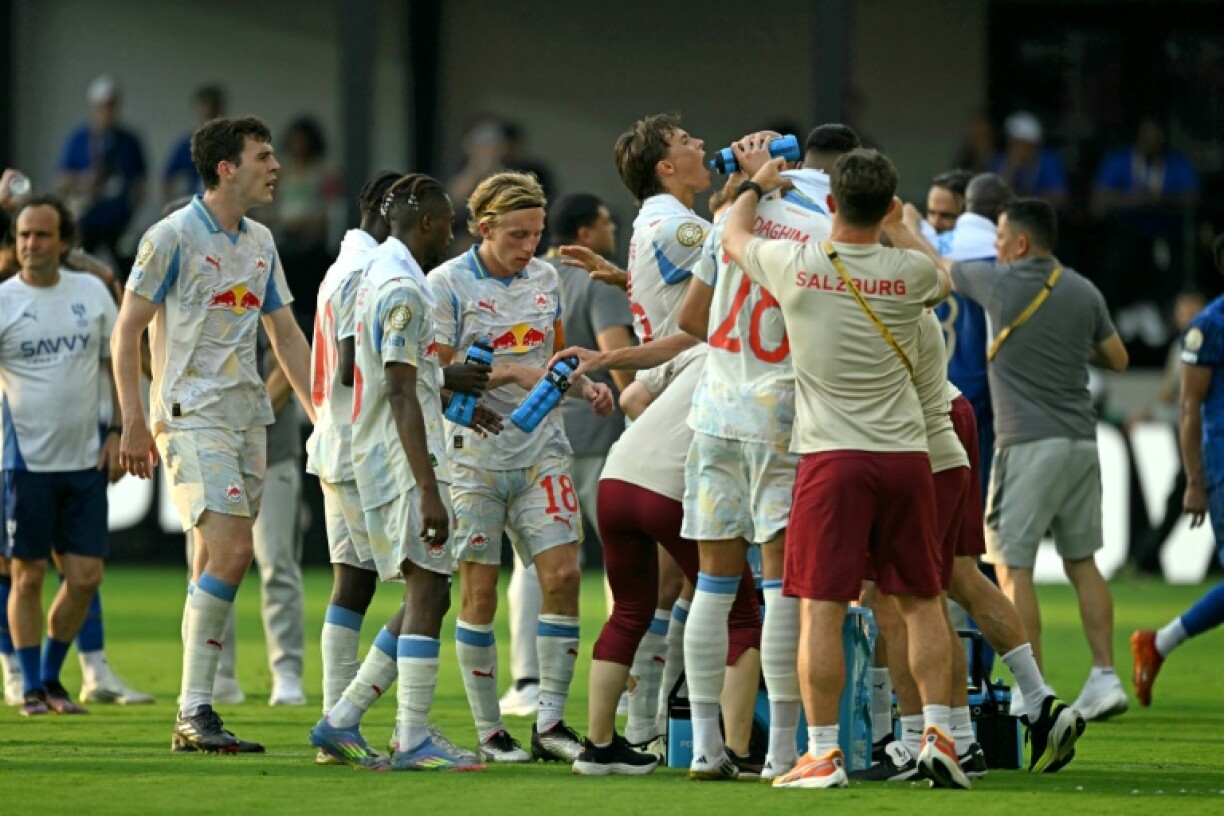 Salzburg players take a water break due to the heat during a Club World Cup match in June