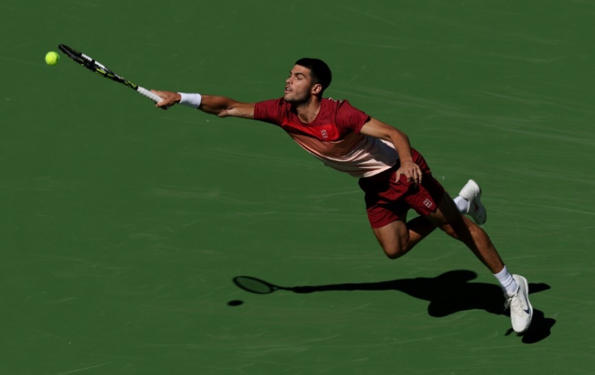Spain's Carlos Alcaraz stretches for a forehand in his second-round victory over Quentin Halys of France at Indian Wells