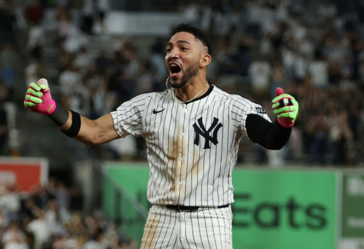 Jose Caballero of the New York Yankees celebrates his walk off single that lifted New York to a victory over the Chicago White Sox and into the Major League Baseball playoffs