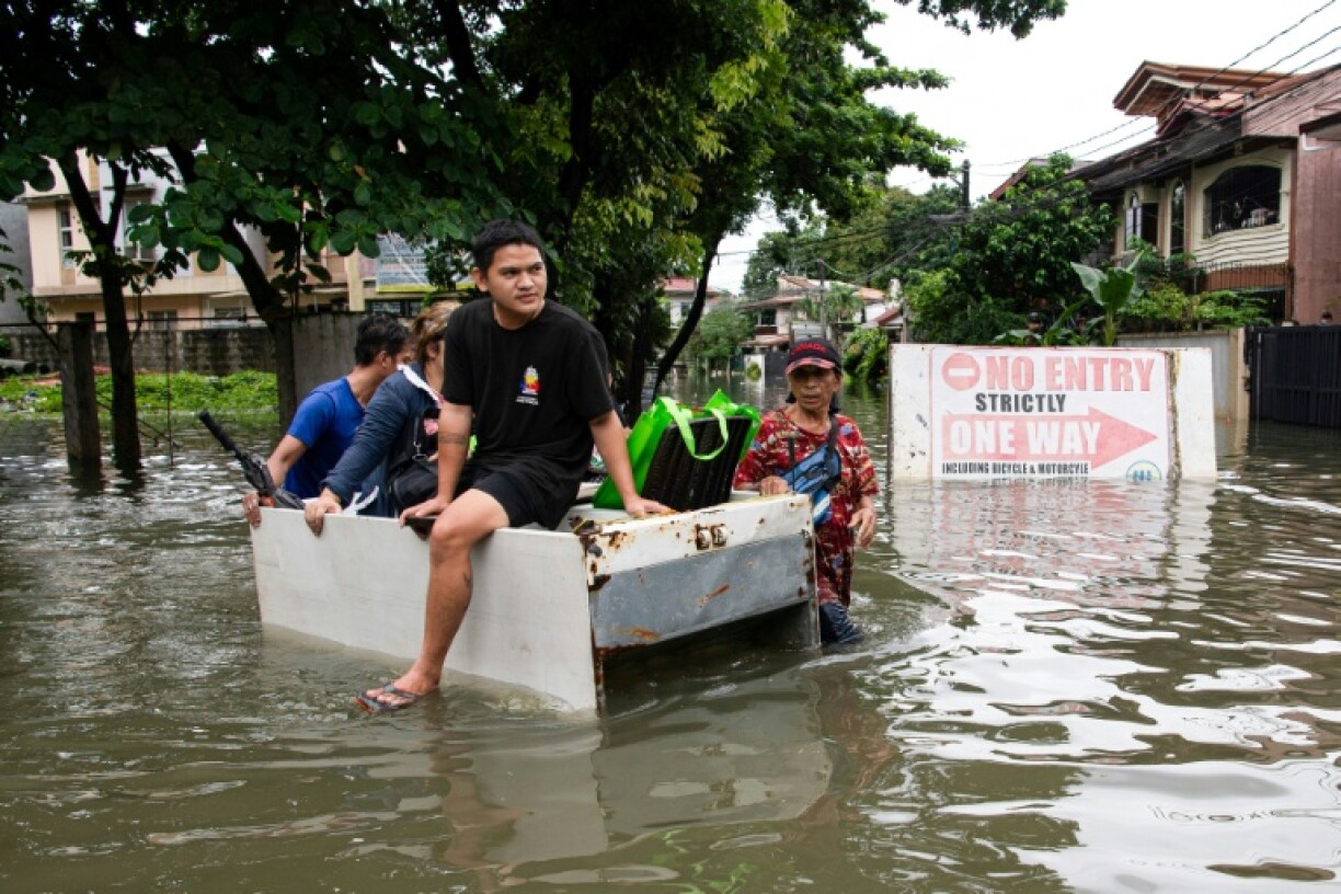 In Cainta, a small town on the outskirts of Manila, people turned styrofoam boxes and abandoned refrigerators into makeshift floatations to navigate the floods