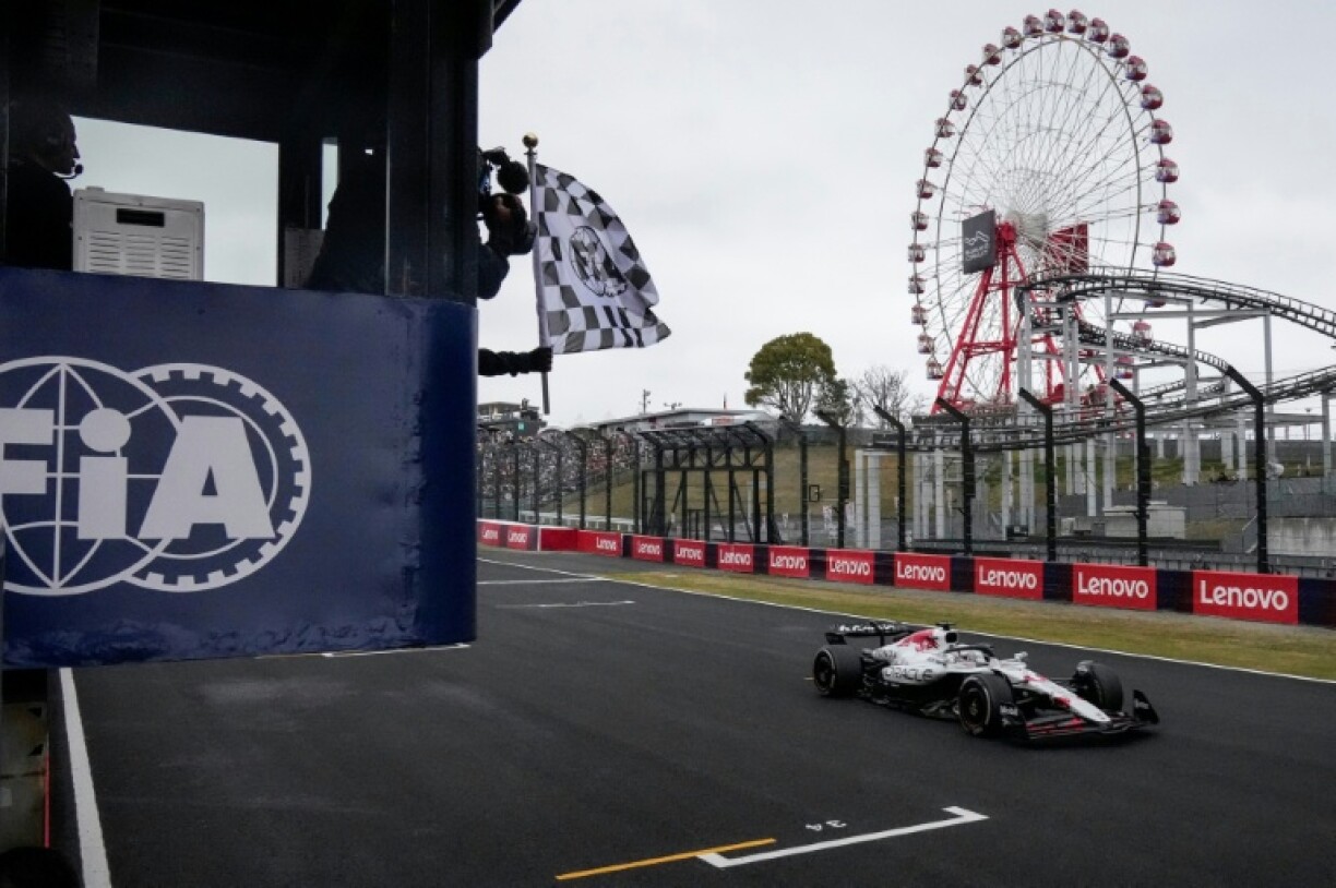 Max Verstappen takes the chequered flag to win the Formula One Japanese Grand Prix Suzuka