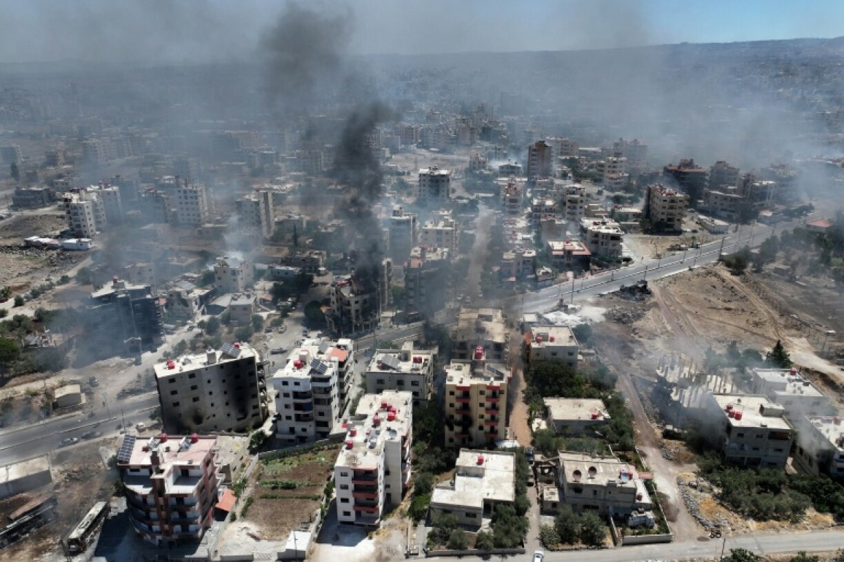 Smoke rises over Sweida as AFP correspondents report gunfire and explosions in several neighbourhoods despite a ceasefire ordered by Syria's Islamist-led government