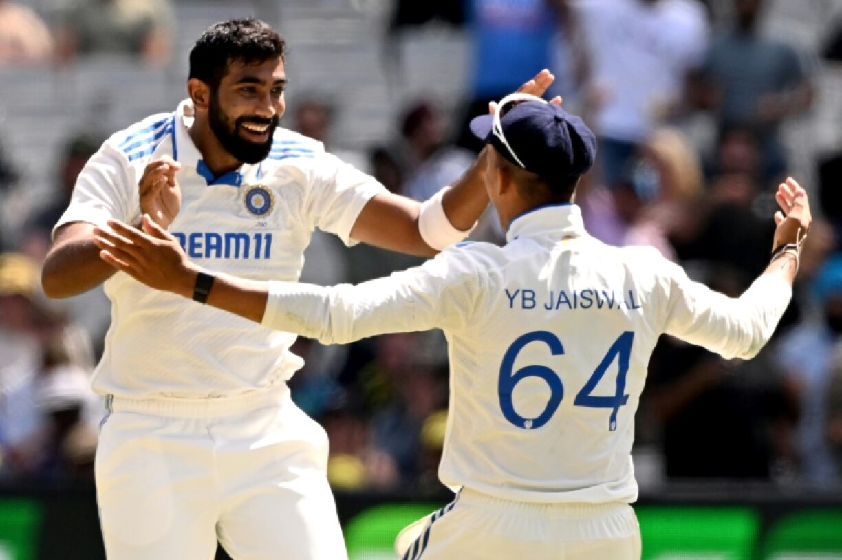 India bowler Jasprit Bumrah (lfet) celebrates with teammate Yashasvi Jaiswal after dismissing Australia's Sam Konstas