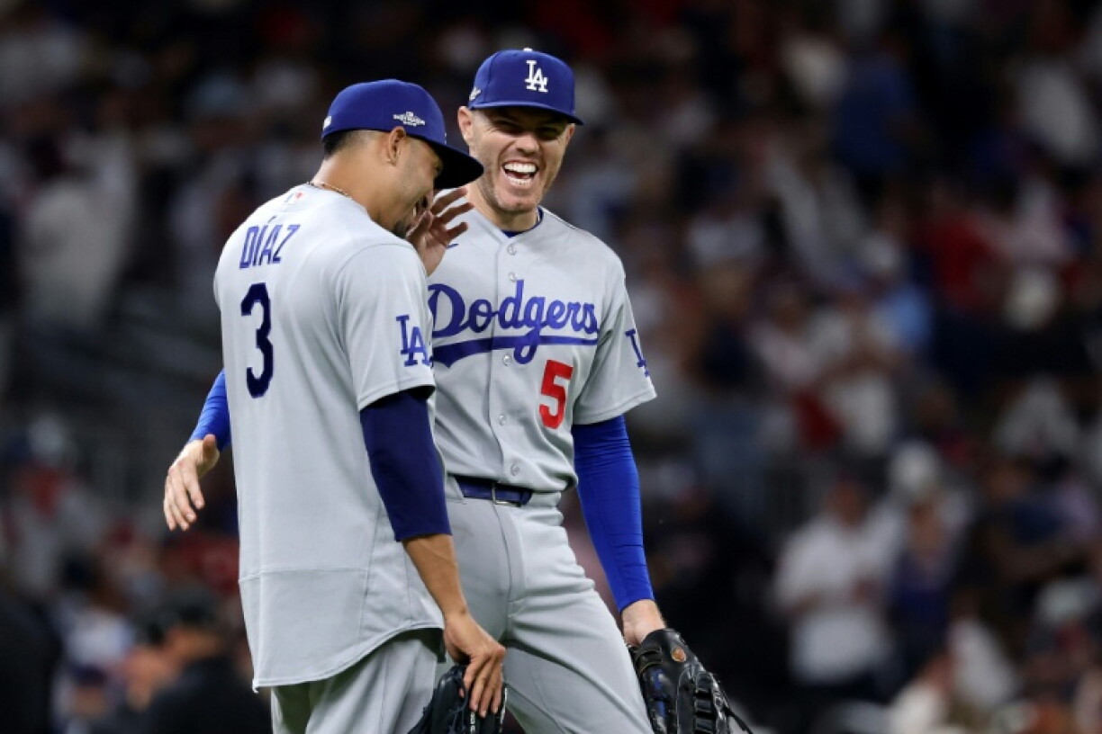 Three-peat bid on track: Edwin Diaz and Freddie Freeman are all smiles after the Los Angeles Dodgers' victory over the Atlanta Braves in the National League division series