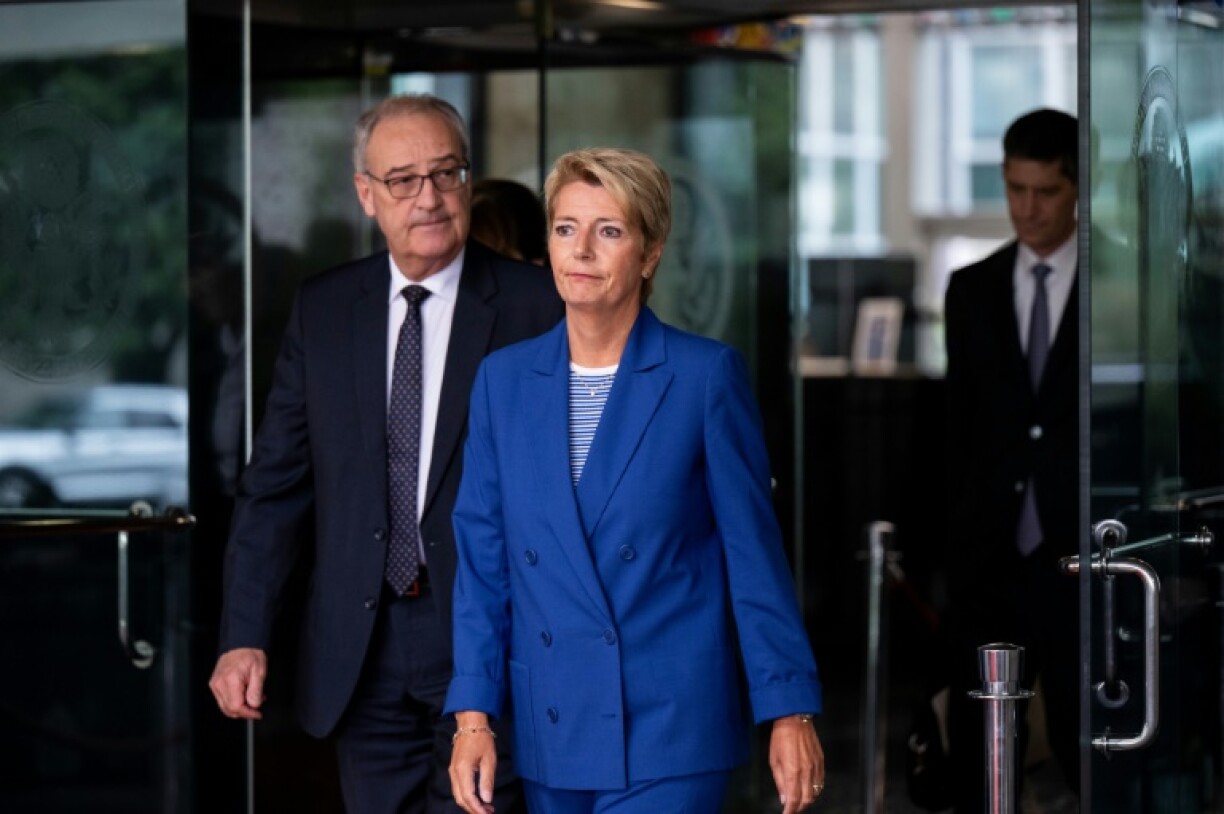 Swiss President Karin Keller-Sutter and Swiss Economy Minister Guy Parmelin depart after a meeting with US Secretary of State Marco Rubio in Washington