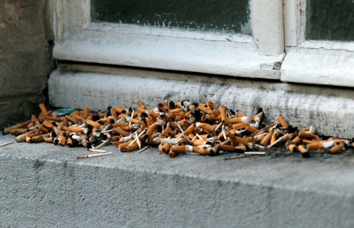 Cigarette butts on a window ledge in Paris