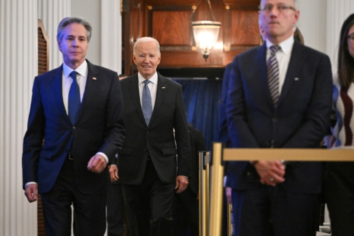 US President Joe Biden, accompanied by Secretary of State Antony Blinken (L), delivered a farewell foreign policy speech to American diplomats at the State Department