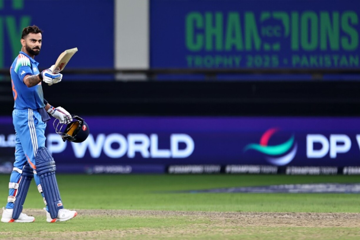 India's Virat Kohli celebrates after scoring a century against Pakistan