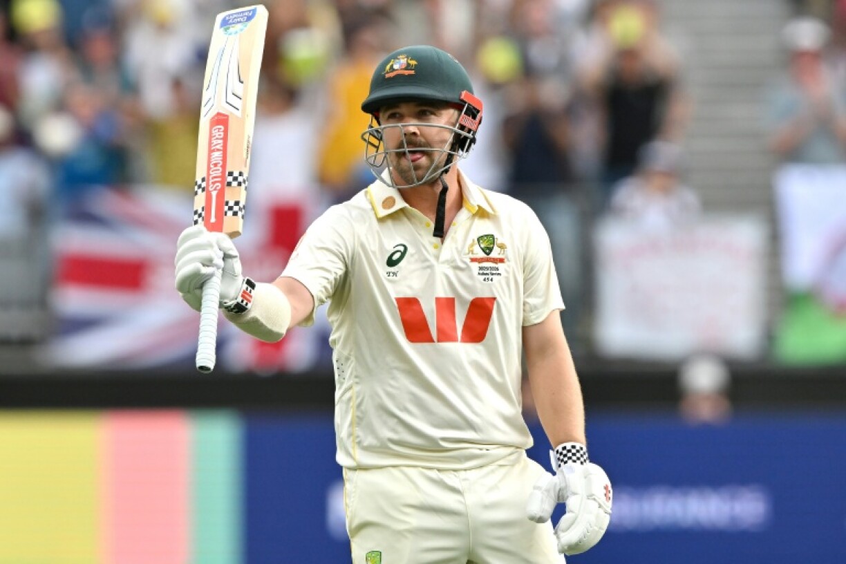 Australia's Travis Head celebrates reaching his century on day 2 of the first Ashes Test against England