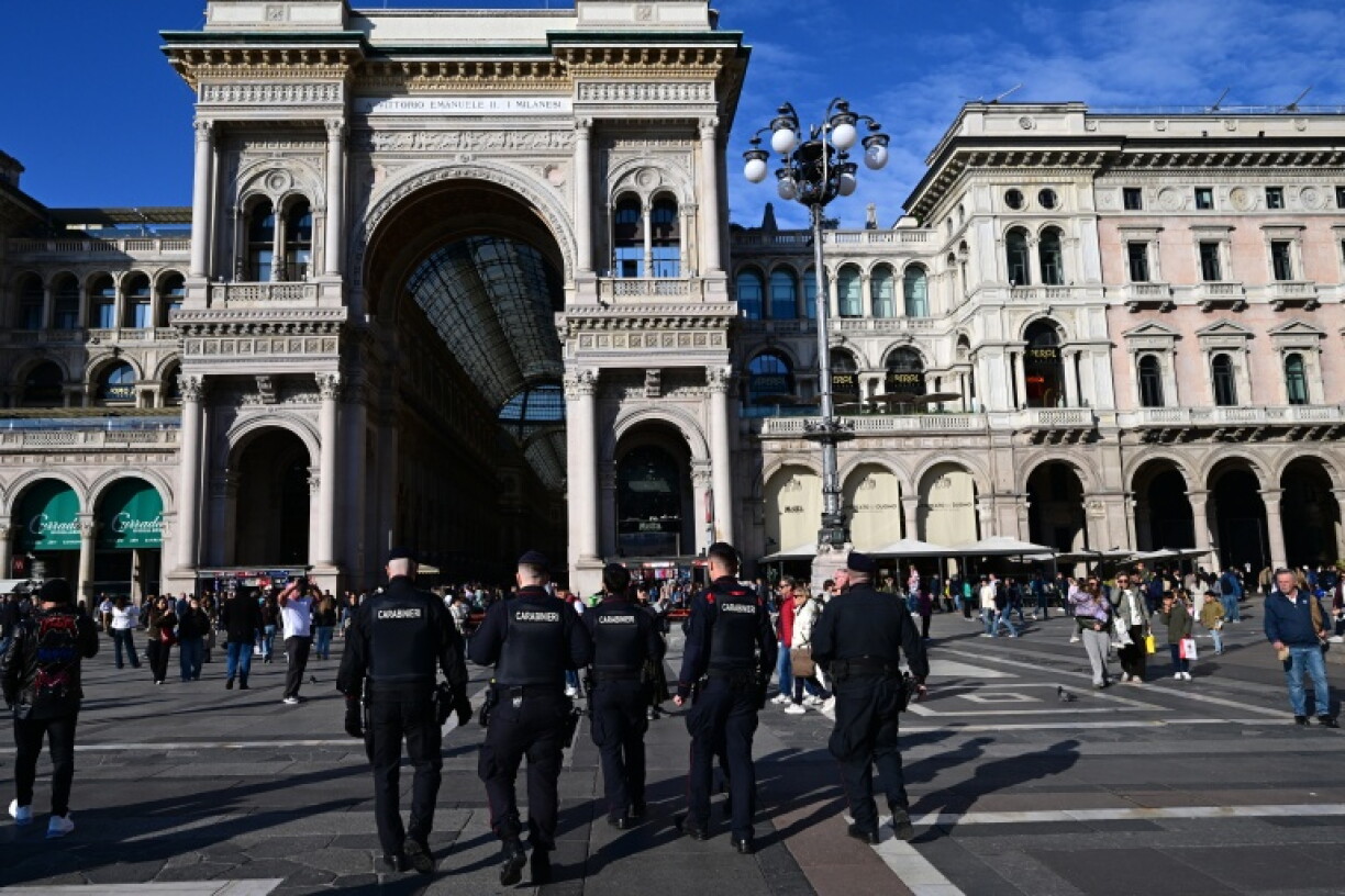 A group of Italy's military police carabinieri patrol at Piazza Duomo in Milan on October 26, 2026