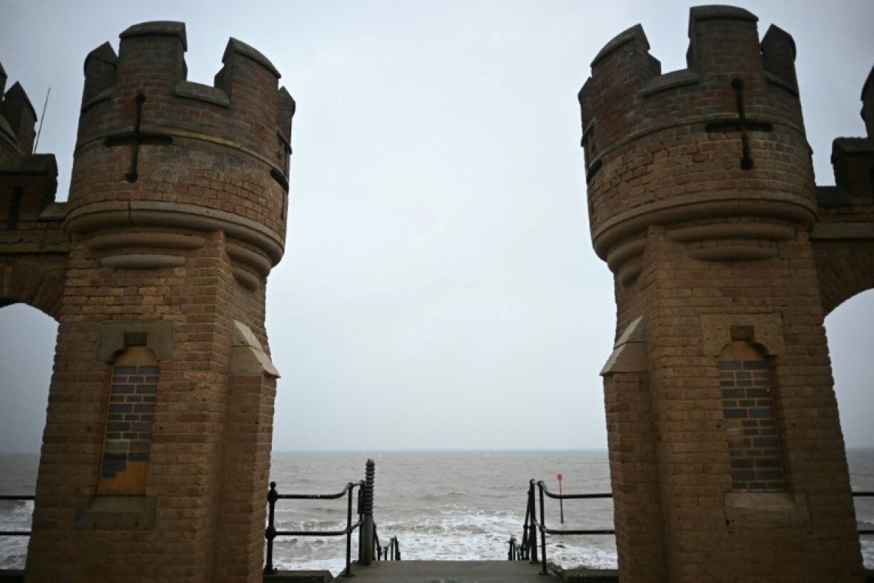 View of the North Sea between the turrets of the entrance to the old pier in Withernsea, on the east coast of England near where a collision between a tanker and a cargo ship caused multiple explosions