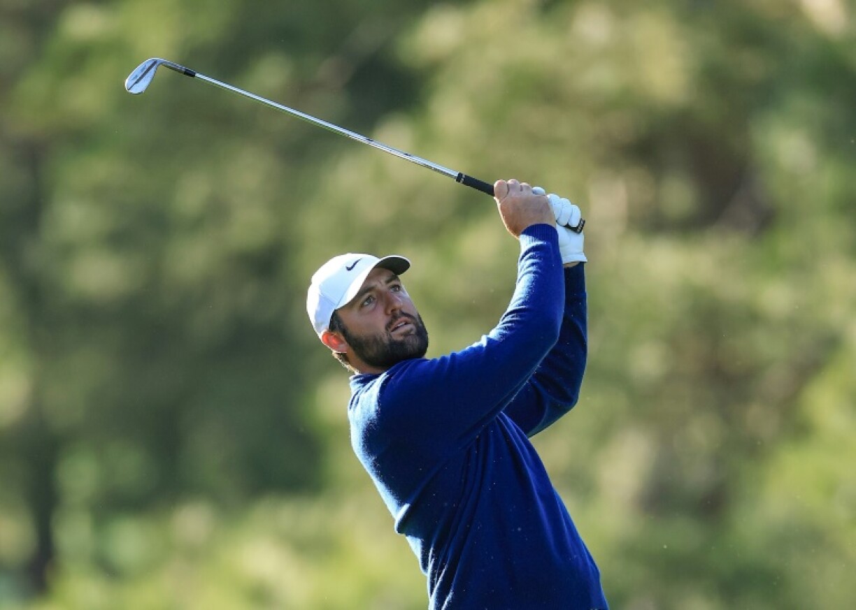 Defending champion Scottie Scheffler plays a shot in the second round of the Masters at Augusta National