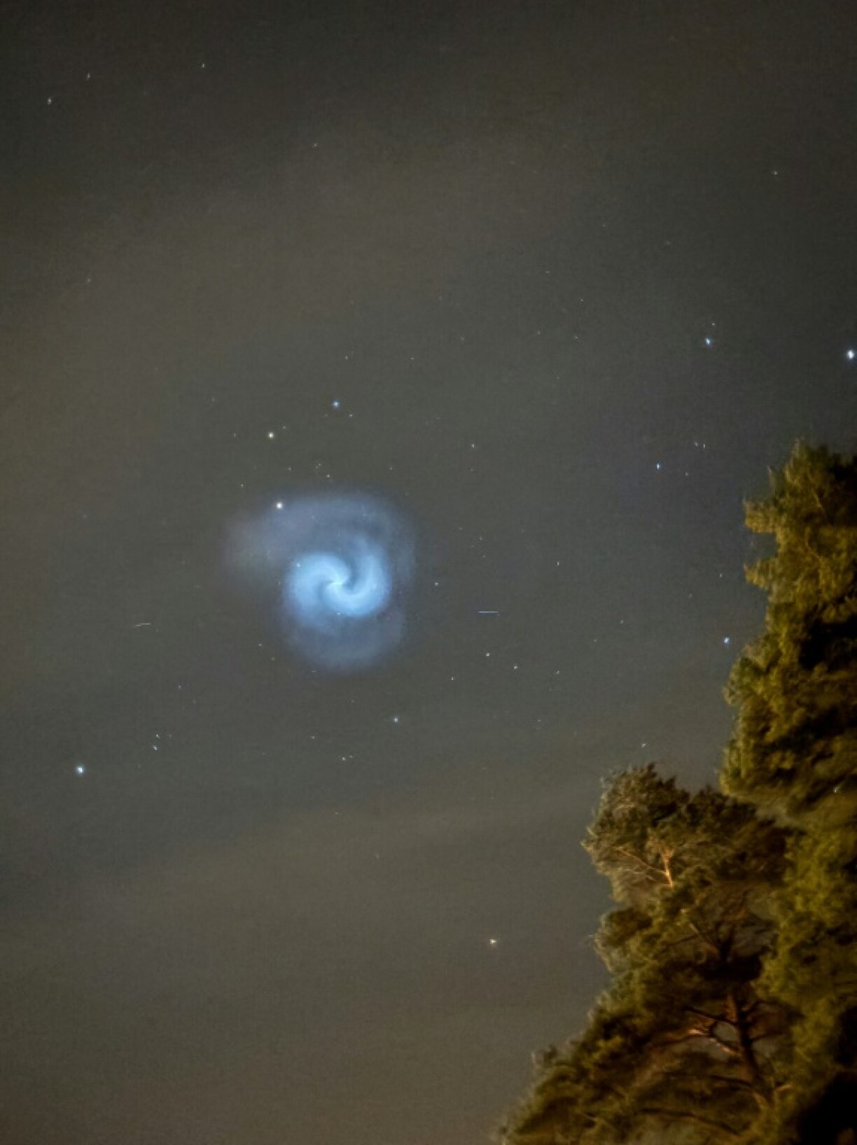 As the rocket's spinning booster fell back to Earth, its fuel froze into crystals to create the spiral