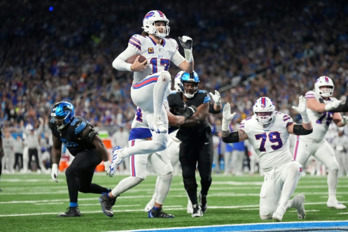 Josh Allen leaps into the end zone for a touchdown in Buffalo's victory over the Detroit Lions