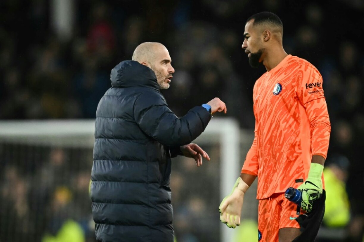 Pleased with a point: Chelsea coach Enzo Maresca (L) speaks with goalkeeper Robert Sanchez at the end of a goalless draw away to Everton at Goodison Park