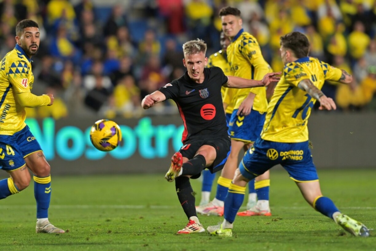 Barcelona playmaker Dani Olmo (C) broke the deadlock with a fine finish against Las Palmas