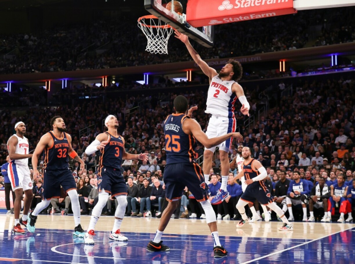 Cade Cunningham of the Detroit Pistons flies to the basket over Mikal Bridges in the Pistons' victory over the New York Knicks in game two of their NBA playoff series