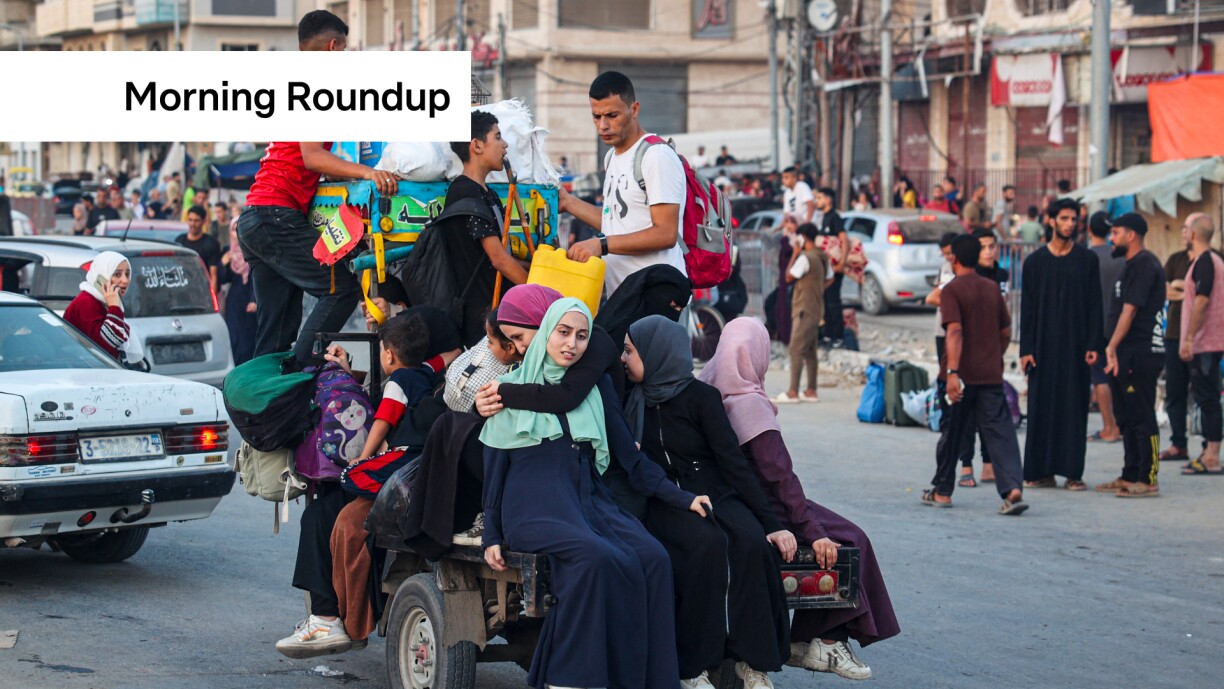 People ride on a cart as Palestinians flee the al-Bureij refugee camp in the central Gaza Strip on July 28, 2024, amid the ongoing conflict between Israel and the Hamas militant group.