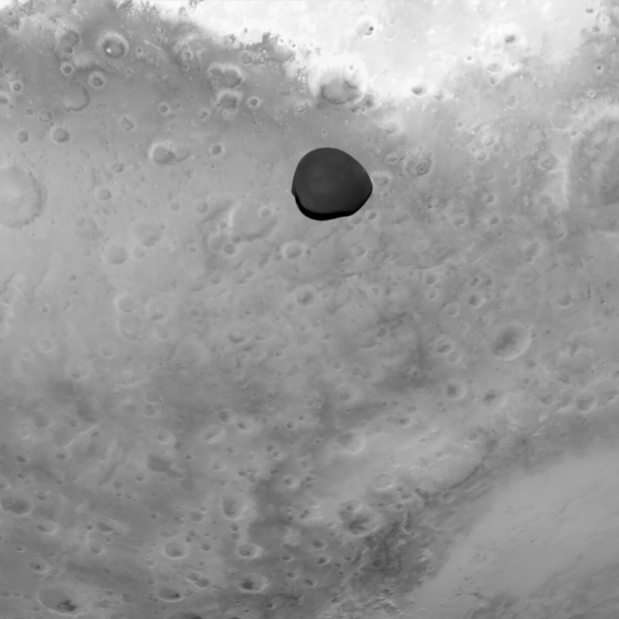 Deimos is the smaller and more mysterious of Mars' two moons