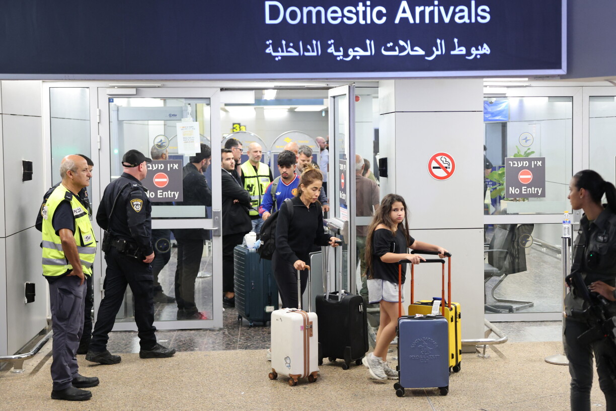 Passengers from an earlier diverted flydubai flight are seen after landing at Israel's Ben Gurion Airport in Lod on September 30, 2026.