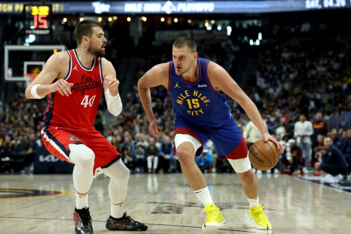 Nikola Jokic of the Denver Nuggets drives against Ivica Zubac in the Nuggets' overtime victory over the Los Angeles Clippers in game one of their NBA Western Conference playoff series