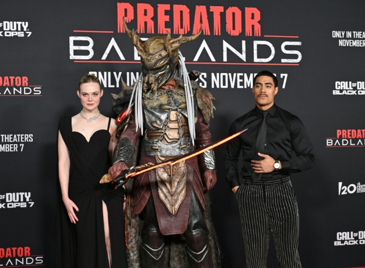 US actress Elle Fanning (L) and New Zealand actor Dimitrius Schuster-Koloamatangi star in 'Predator: Badlands'