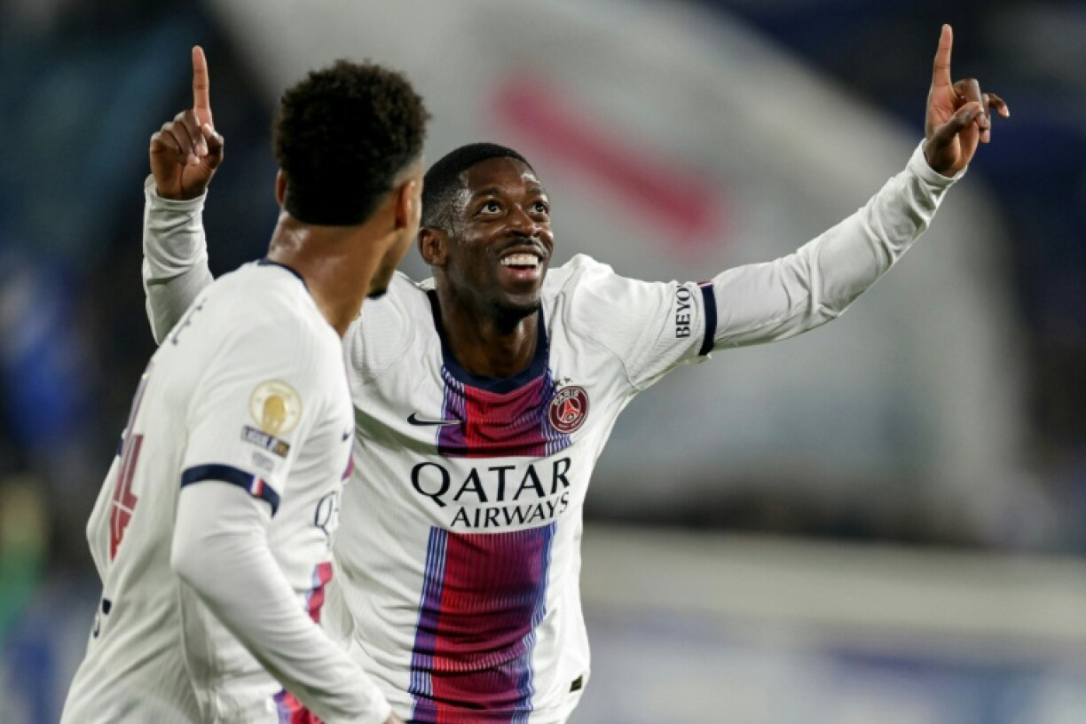 Ousmane Dembele celebrates after scoring in Paris Saint-Germain's 3-1 comeback win at Strasbourg in Ligue 1 on Saturday