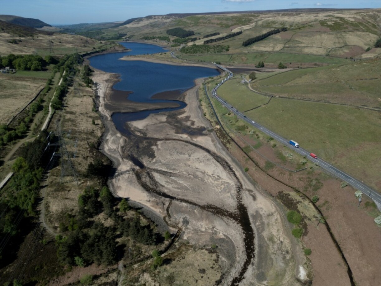 An aerial photo shows the bed of Woodhead Reservoir is partially revealed by falling water levels, near Glossop, northern England as the country experiences its driest start to spring in 69 years