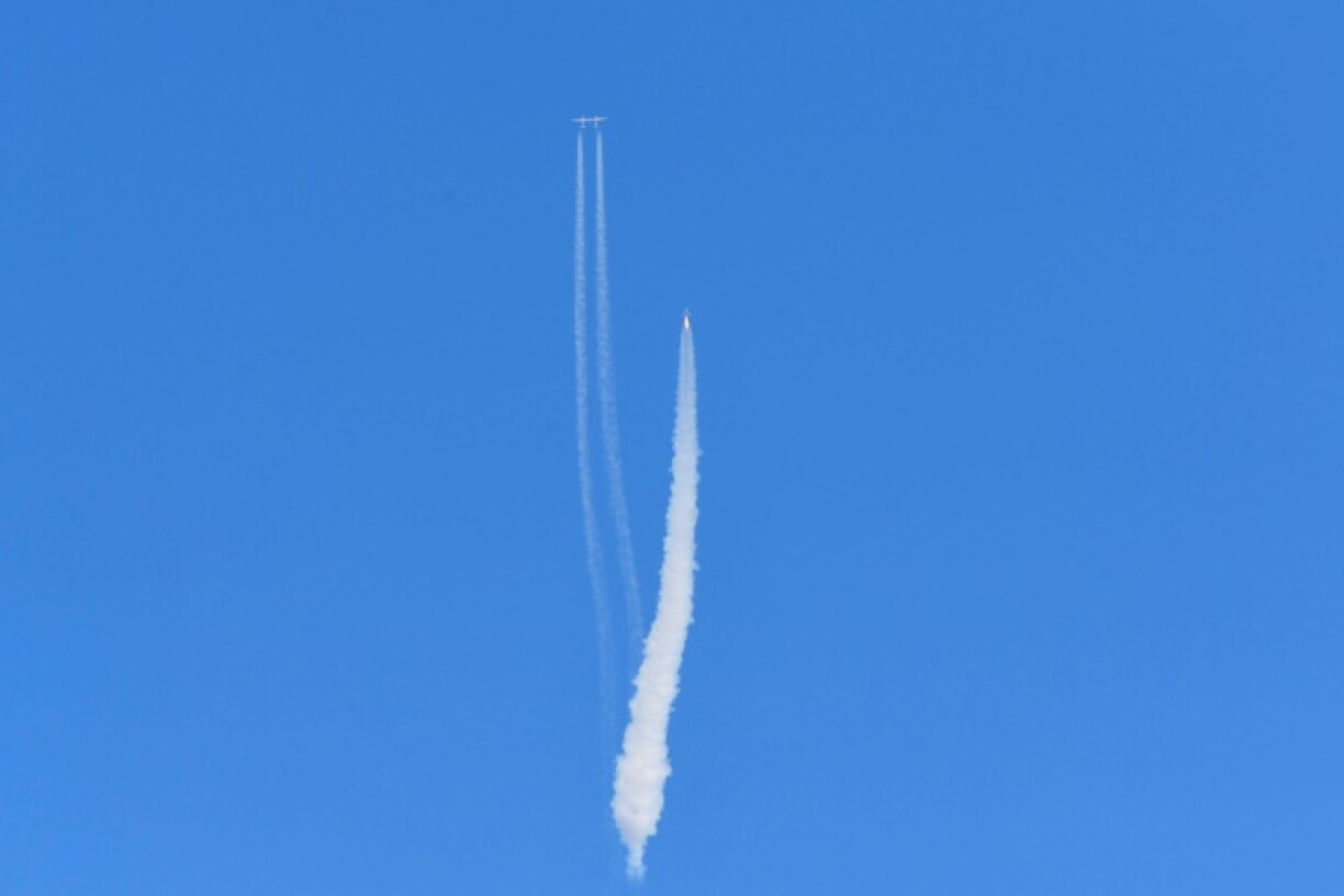 The Virgin Galactic SpaceShipTwo space plane Unity and mothership flies above Spaceport America, near Truth and Consequences, New Mexico on July 11, 2021