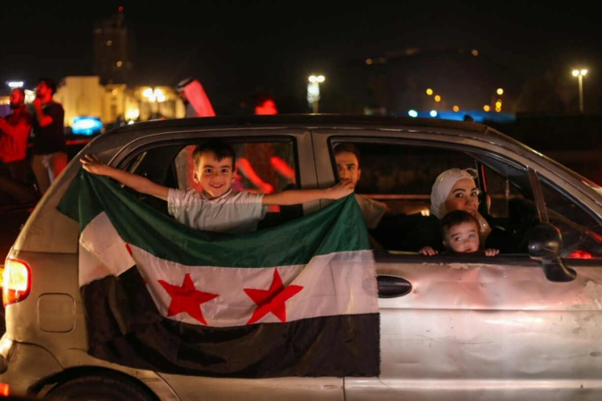 Syrians celebrate President Donald Trump's announcement that he will lift US sanctions on the war-battered country.