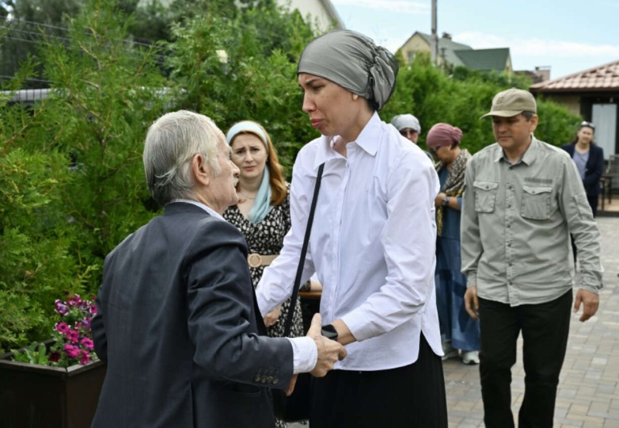 Natalya Sadikov at the funeral of her husband Aydos, who had won a widespread following with videos criticizing Kazakhstan's ruling elite