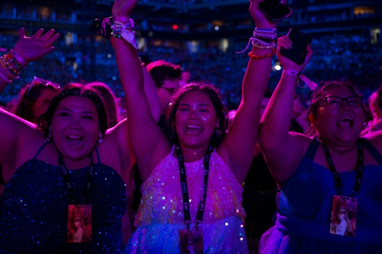 Fans of Taylor Swift cheer during the Miami stop of the Eras tour