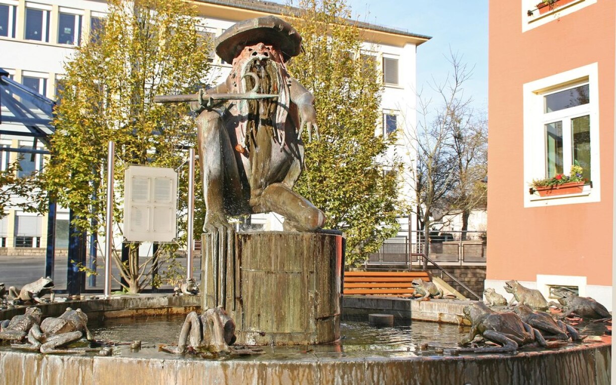Kropemann fountain in Redange. The eerie bogeyman is the symbolic figure of the commune.