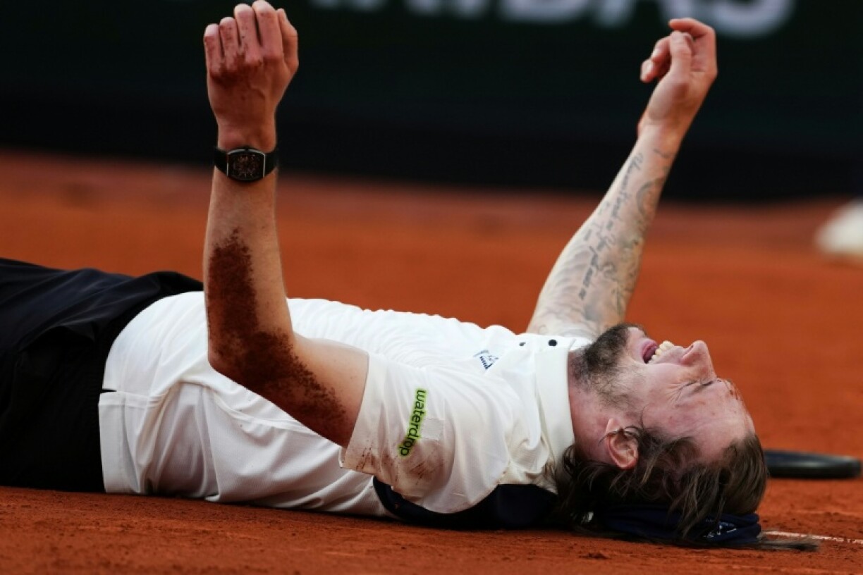 An emotional Alexander Bublik celebrates the