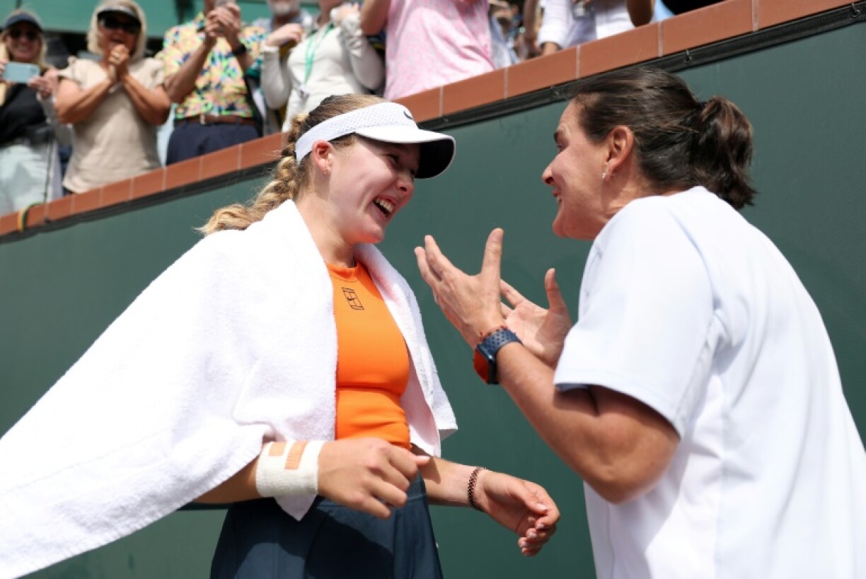 Russian Mirra Andreeva celebrates with coach Conchita Martinez after beating Aryna Sabalenka in the Indian Wells WTA 1000 final
