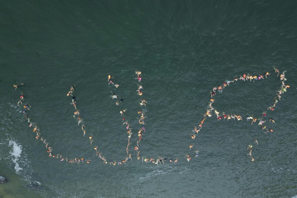In Rio de Janeiro, swimmers at the Praia Vermelha beach joined in formation to spell out Lula's name in the water