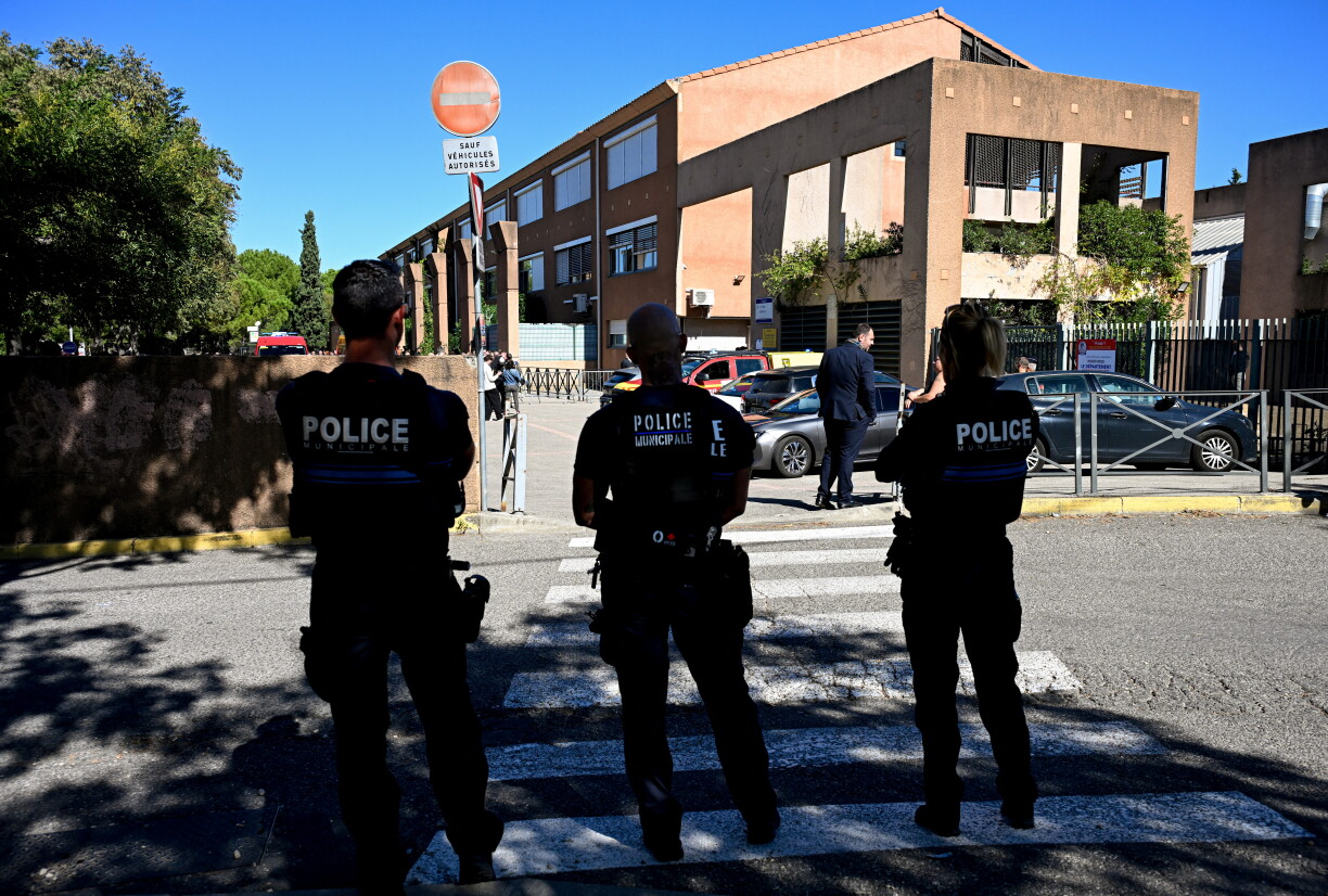 French municipal Police officers patrol outside the Joseph-Lakanal middle school after a headmaster was shot and wounded with a hunting rifle and a teenager was arrested in Aubagne, southern France on October 12, 2026.