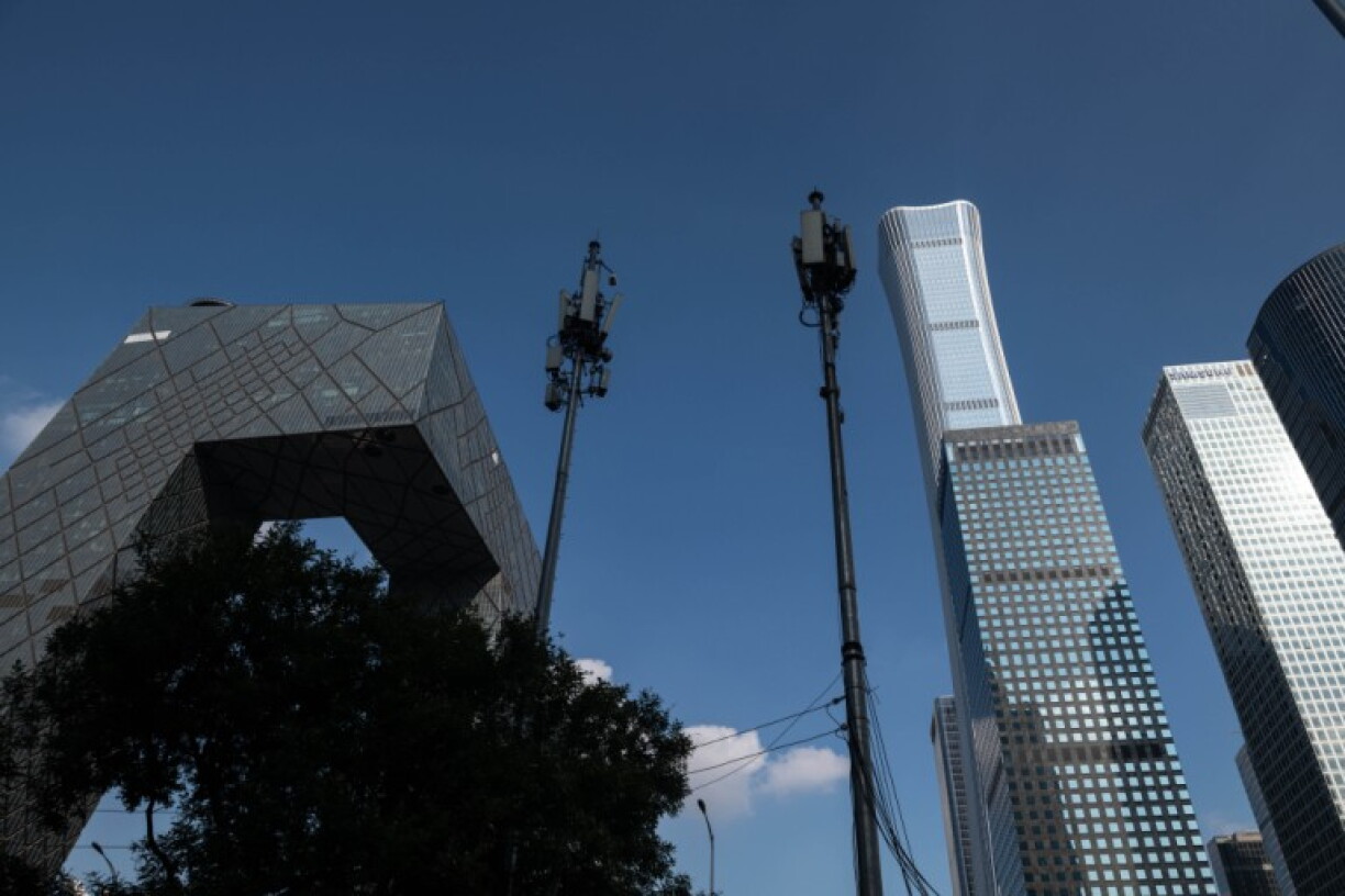 Two 5G towers are pictured in Beijing in 2020