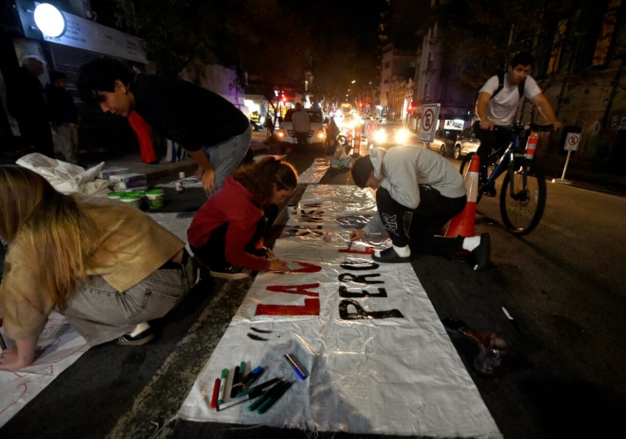Supporters of late Uruguay's President Jose Mujica wrote messages on banners at the Frente Amplio party headquarters in Montevideo