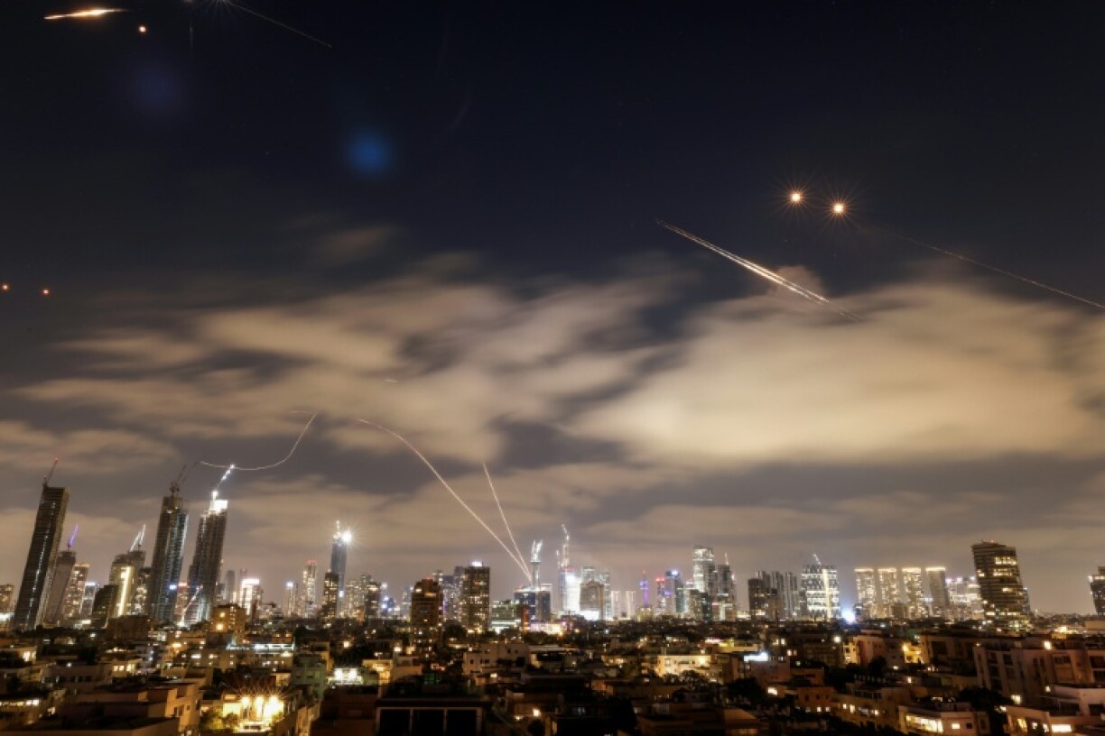 Israeli air defence systems work to intercept Iranian missiles over Tel Aviv on Sunday