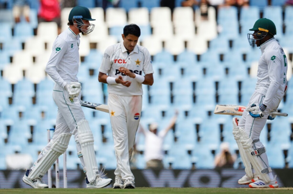 Marco Jansen (L) and Kagiso Rabada (R) celebrate after guiding South Africa to victory in the first Test against Pakistan