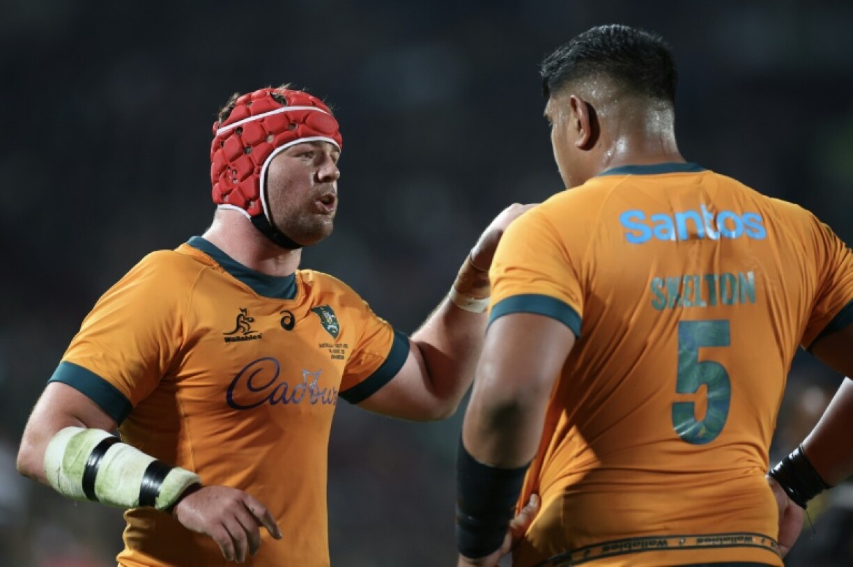 Australia's number eight Harry Wilson (L) speaks with Australia's lock Will Skelton (R) during the Rugby Championship first round Test match between South Africa and Australia at Ellis Park Stadium in Johannesburg on August 16, 2025