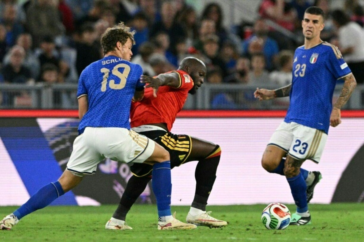 Italy defender Giorgio Scalvini takes on Belgium striker Romelu Lukaku in the Nations League in Rome
