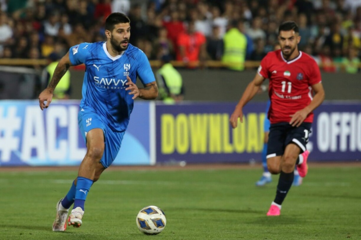 Aleksandar Mitrovic (L) misses out on Al Hilal's AFC Champions League clash with Pakhtakor after a medical test found him to have an irregular heart beat