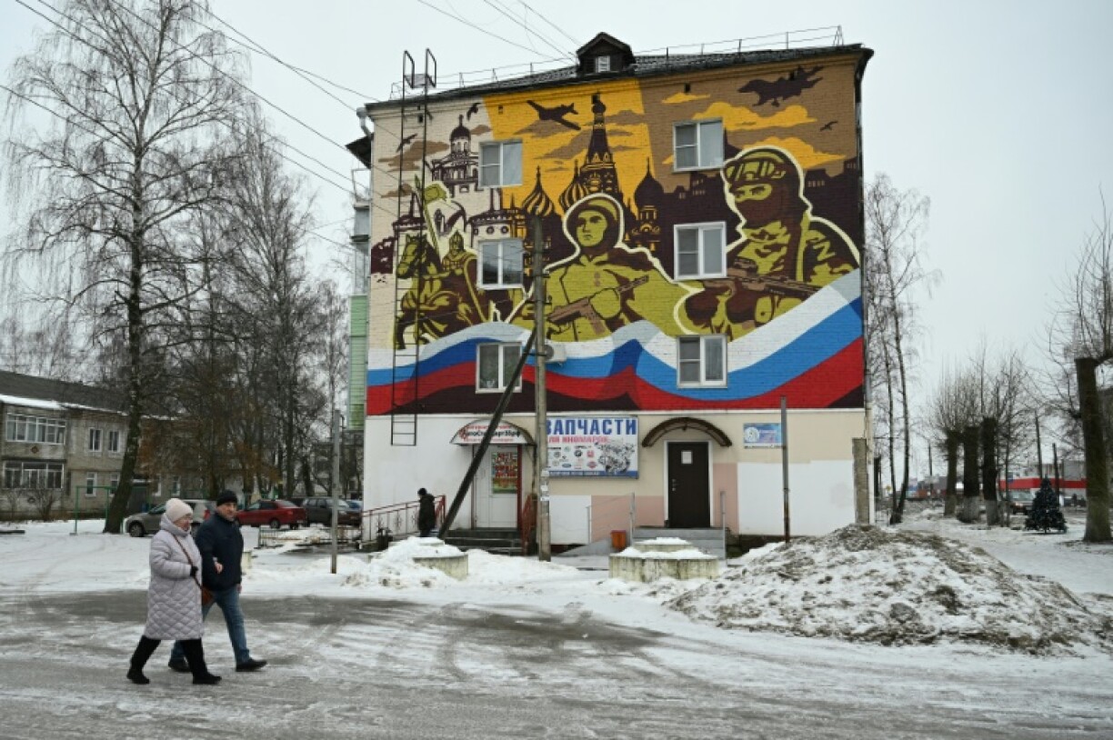 A military-themed mural decorates the wall of a residential building in the town of Petushki in the Vladimir region, Russia