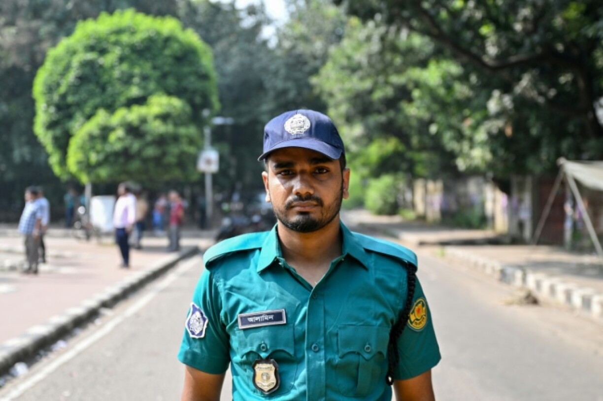 A Bangladesh police officer wears the old turquoise-and-blue uniform in Dhaka