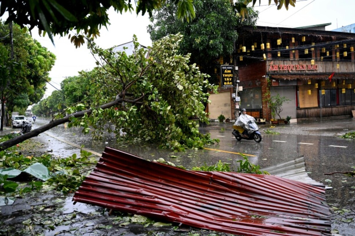Typhoon Kajiki downed trees and tore roofs off thousands of homes in Vietnam