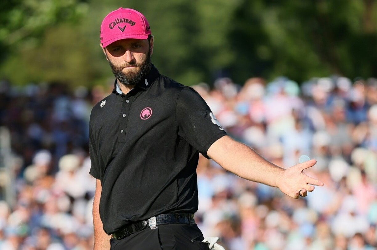 Spain's Jon Rahm reacts to a missed putt on the 18th green during the final round of the PGA Championship at Quail Hollow