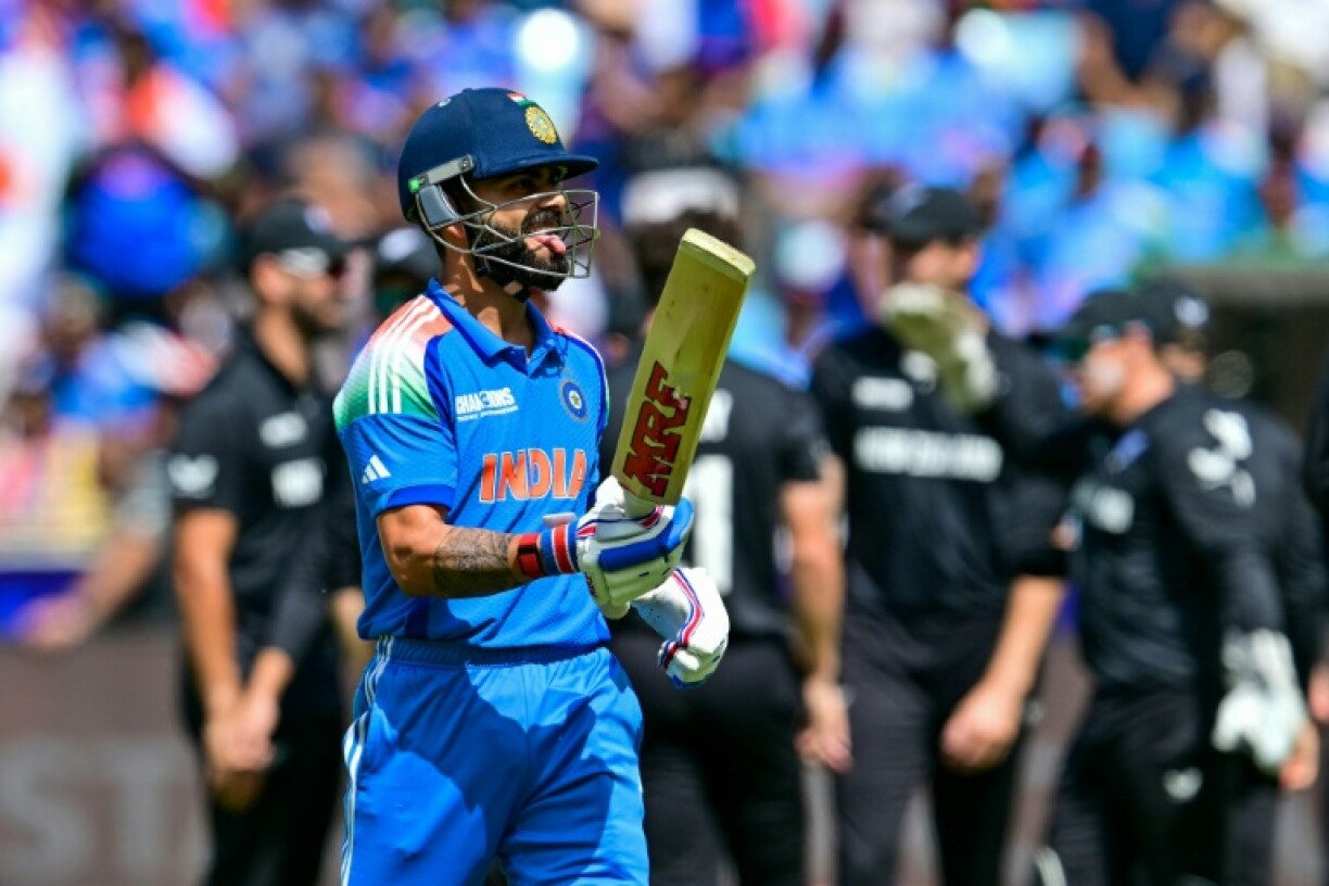 A baffled Virat Kohli leaves the crease after seeing New Zealand's Glenn Phillips produce a wonder catch in India's final Champions Trophy group game in Dubai