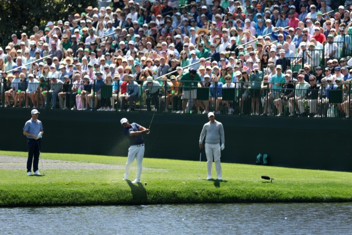 Brooks Koepka of the United States skips his ball on pond at the 16th hole during a practice round prior to the 2025 Masters at Augusta National